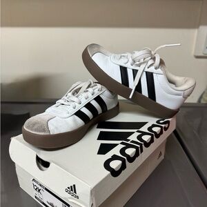 Adidas White Sneakers with Black Stripes and Brown Sole